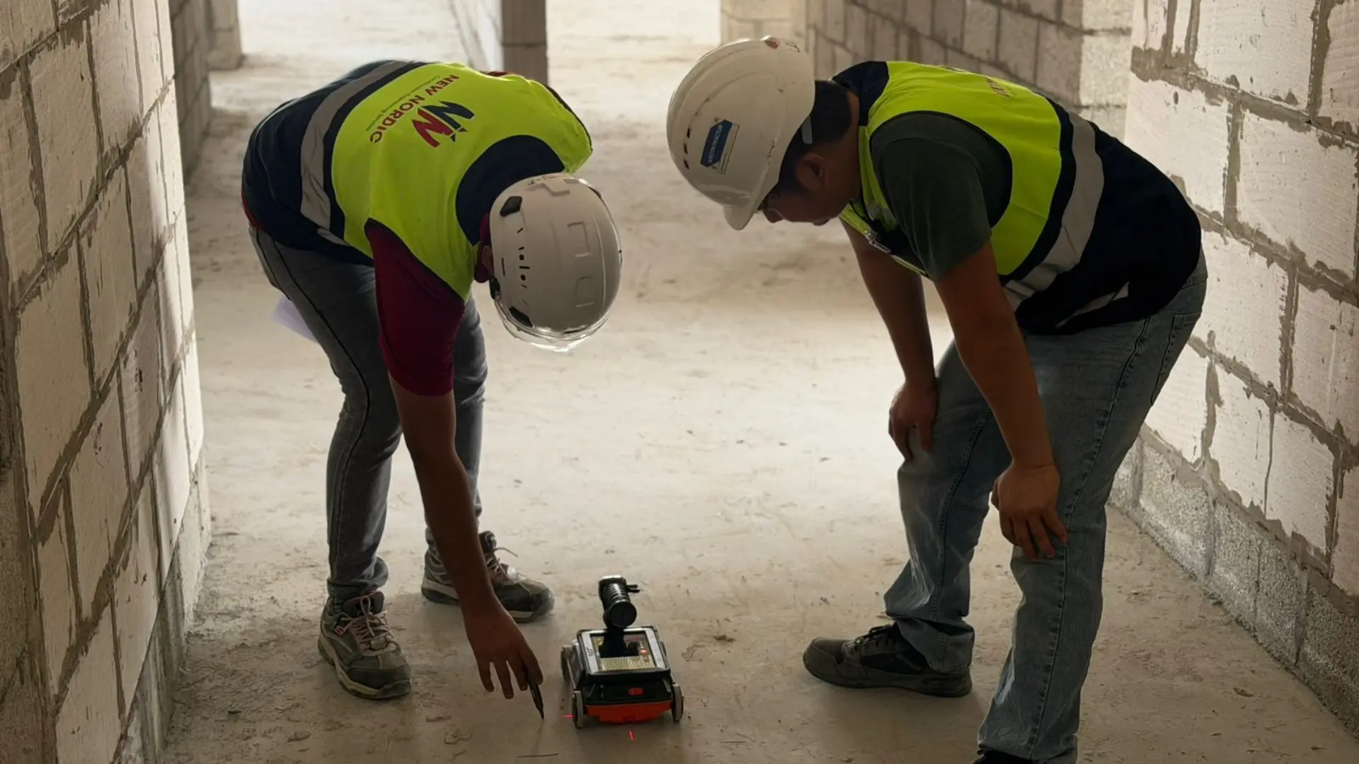 Engineer inspecting building facade and envelope for water ingress and structural defects in the UAE